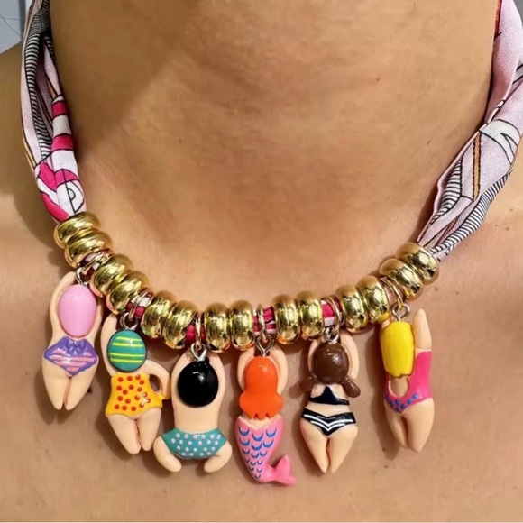 Anthropologie Jewelry - Anthropologie Gold Beaded Necklace with Colorful Swimmer Charms